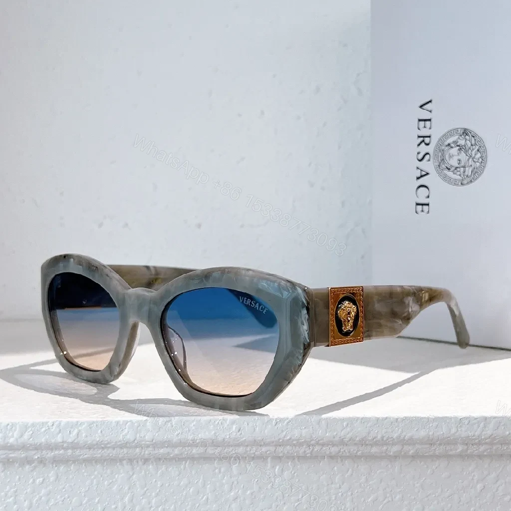 View 7 of Bold Tortoise Cat-Eye Sunglasses with Gold Medallion Accents
