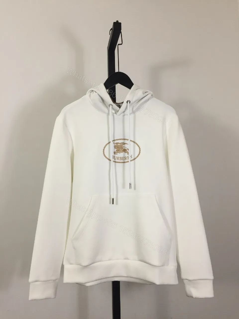 Neutral Off-White Luxury Hoodie with Crest Embroidery — view 1