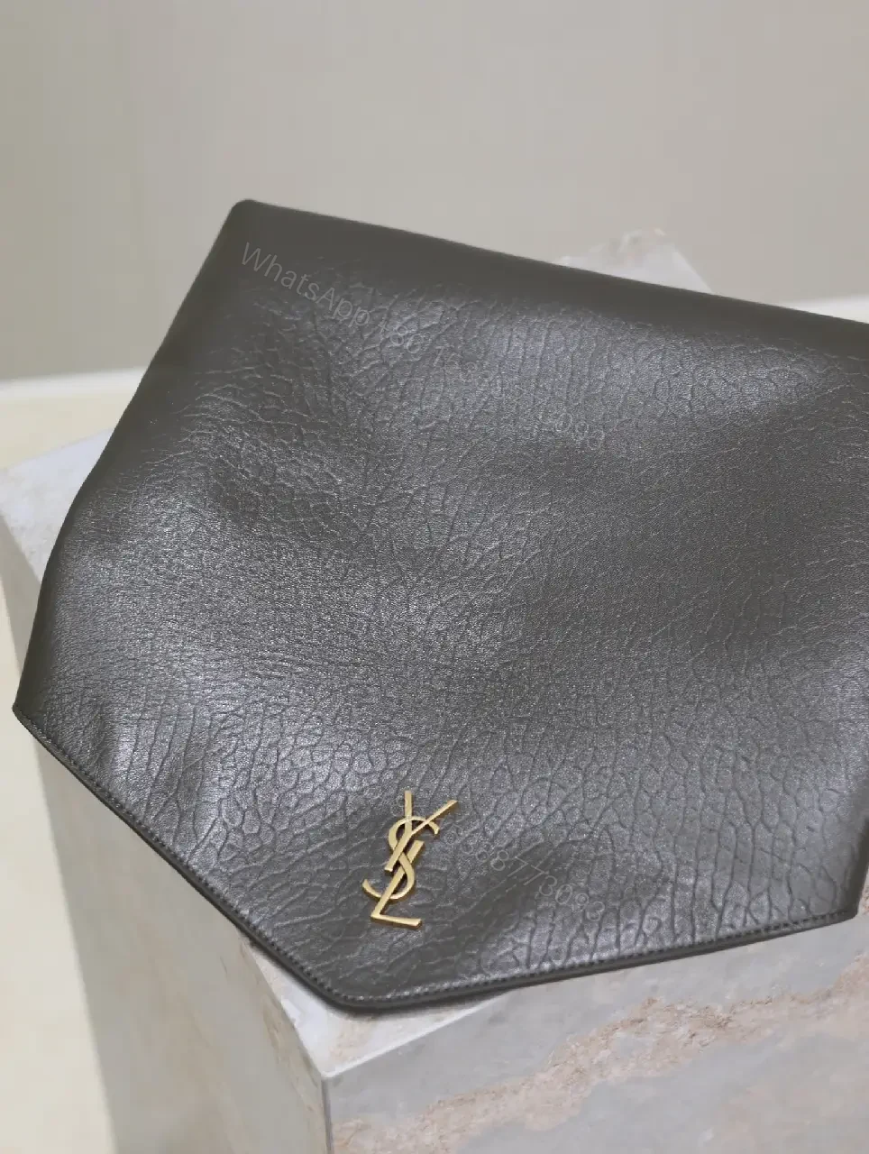 View 7 of Textured Black Leather Envelope Clutch with Gold Logo Signature