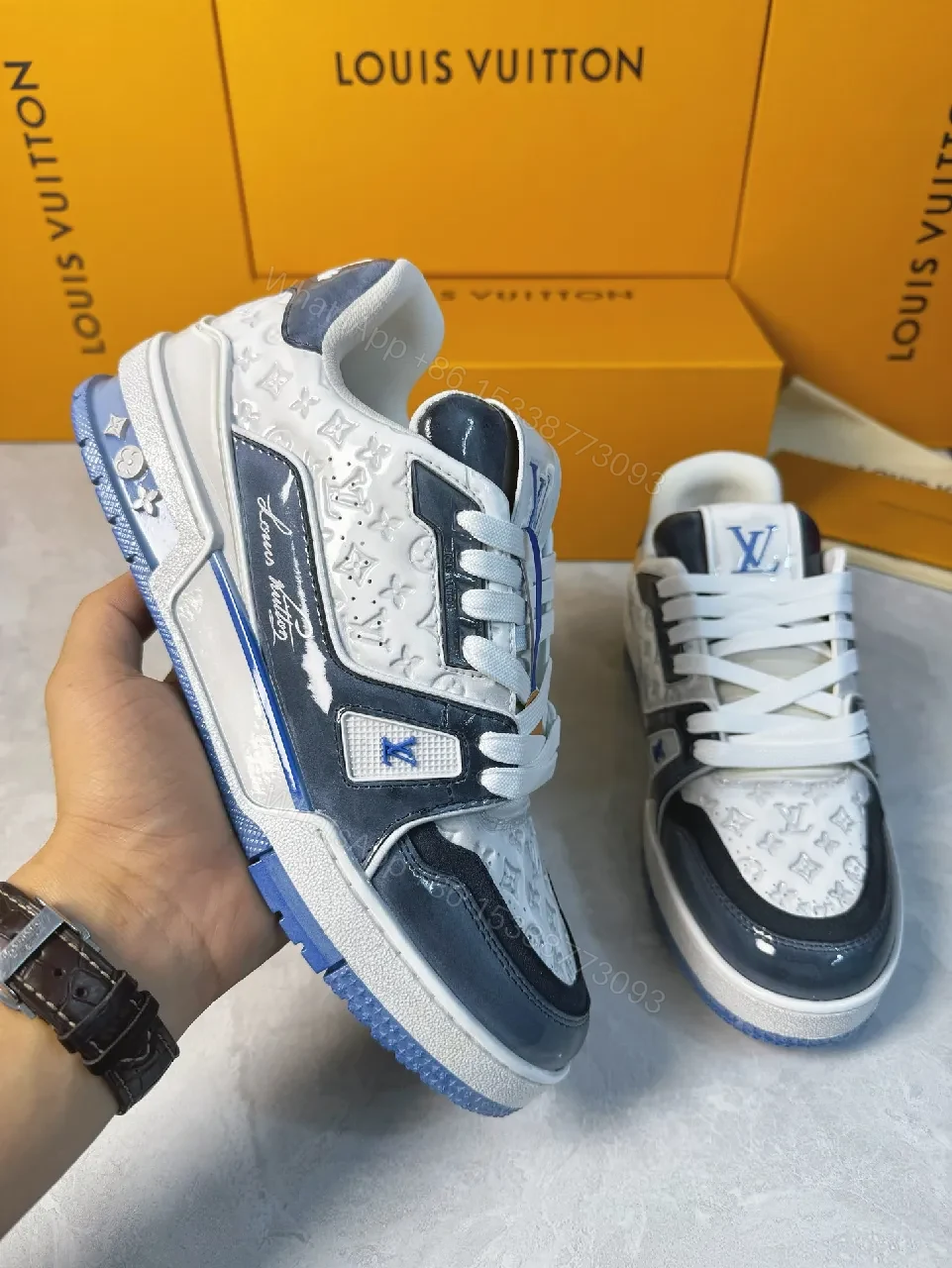 View 6 of Bold Navy Leather Textured Sneakers with LV Accent