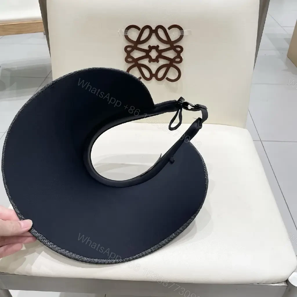 View 6 of Bold Sun Visor with LV Flair: Luxury-Casual Headwear