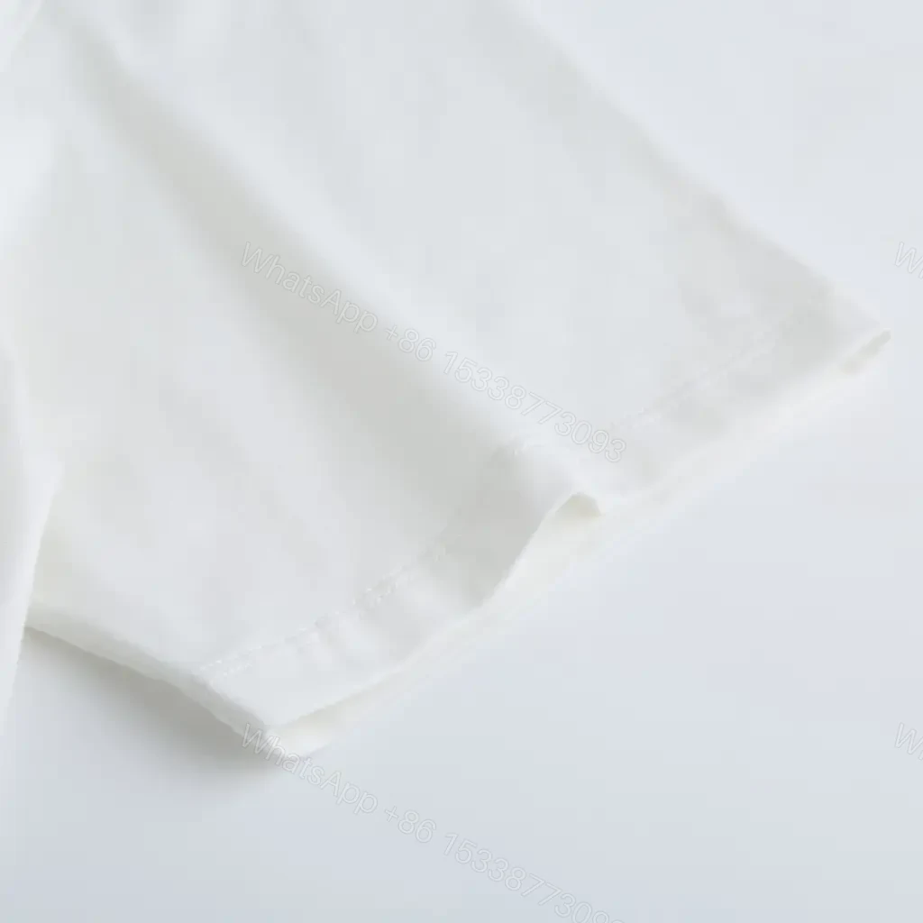 View 6 of White Cotton Tee: Premium Logo Graphic, Relaxed Fit, Durable
