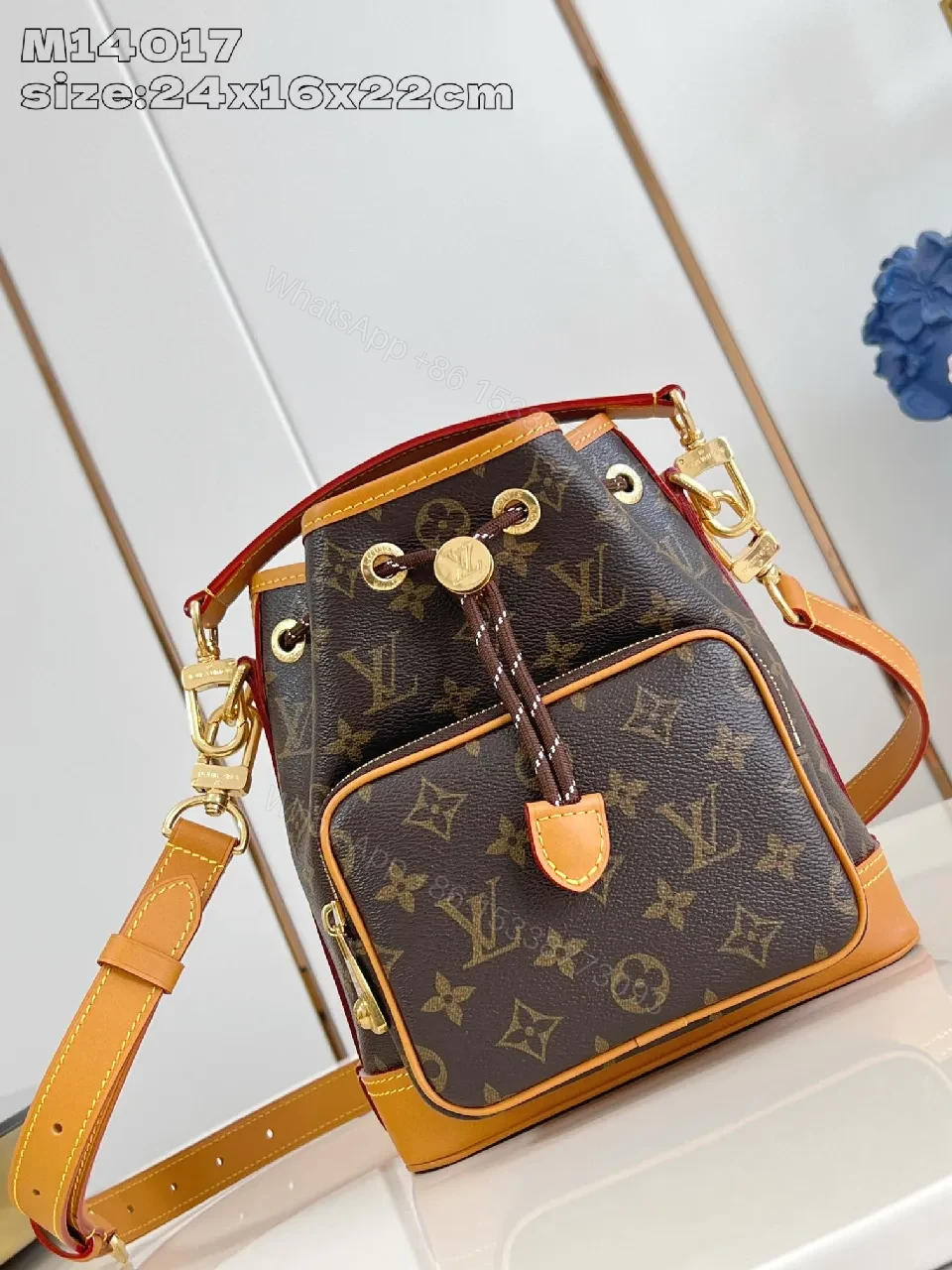 Monogram Canvas Crossbody Bucket Bag with Leather Trim — view 1