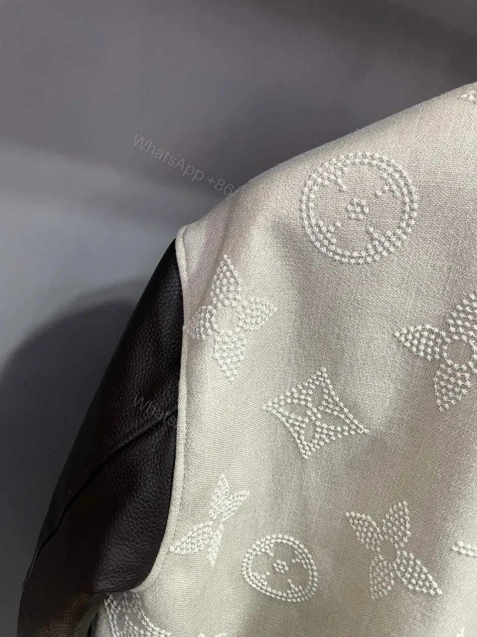 View 2 of Textured Monogram Varsity Jacket: Modern Luxury, All-Day Comfort