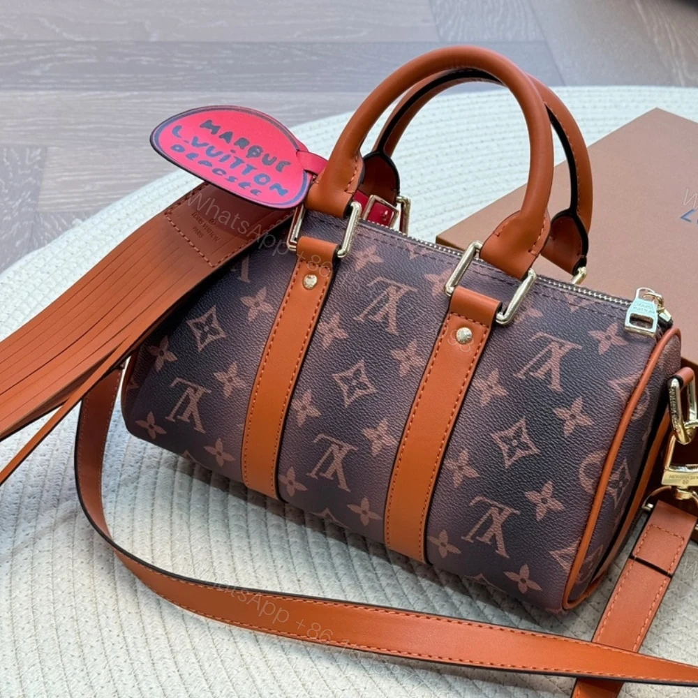 View 2 of Louis Vuitton Keepall Bandoulière 25 Monogram Dust Coated Canvas Brown 25Cm M11542