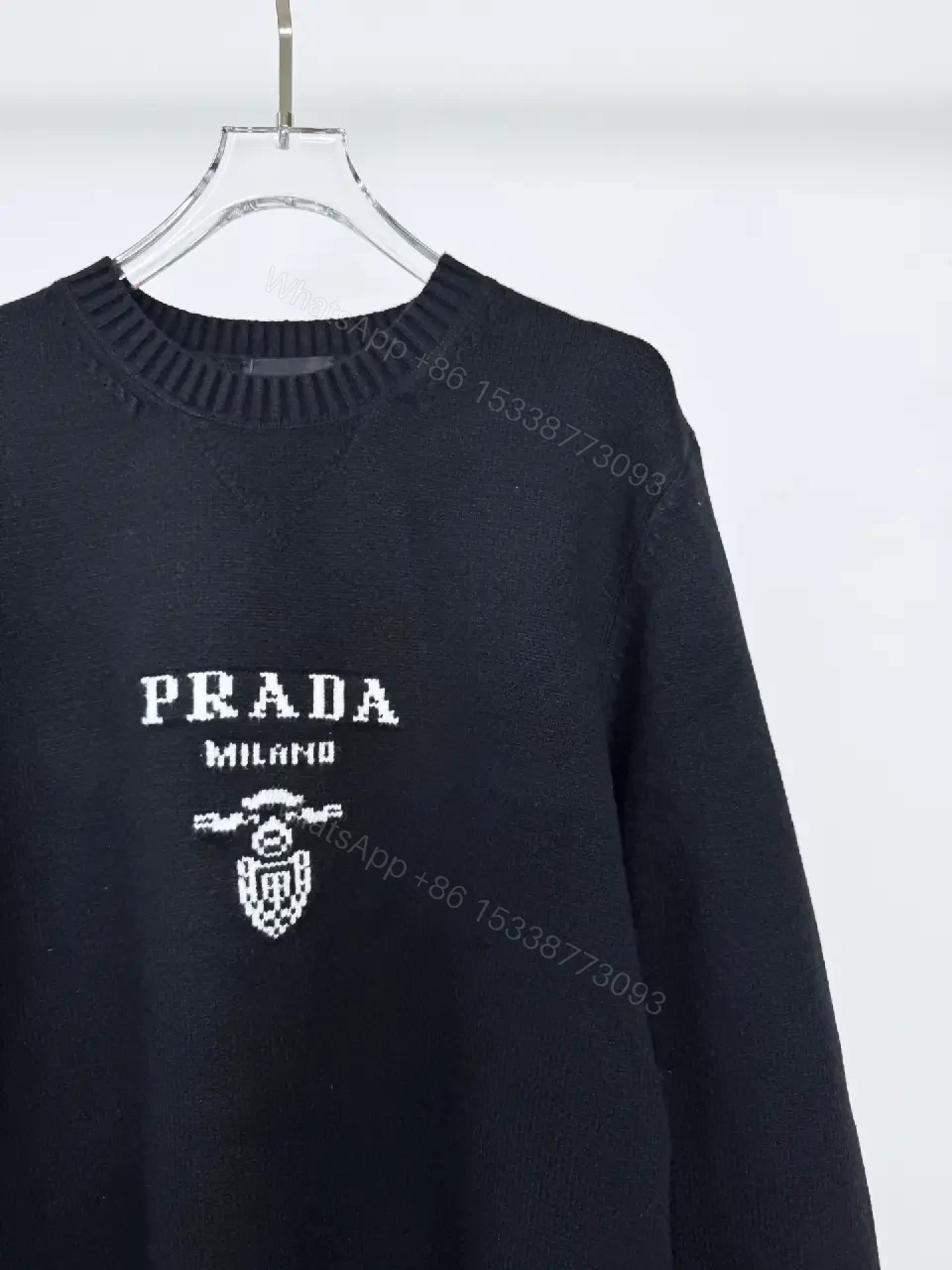 View 7 of Black Knit Pullover with Crest – Elevated Comfort Knitwear