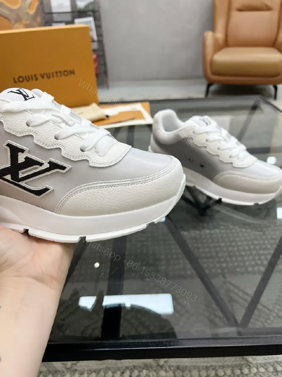 View 8 of White Leather Minimalist Luxe Sneakers with LV Detail