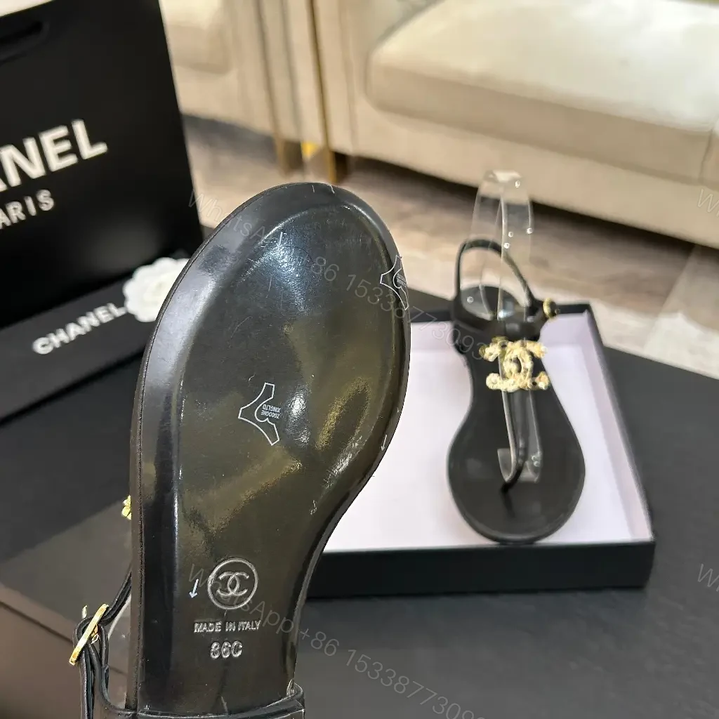 View 7 of Minimalist Black Leather Sandals with Gold Charms - Elegant Comfort