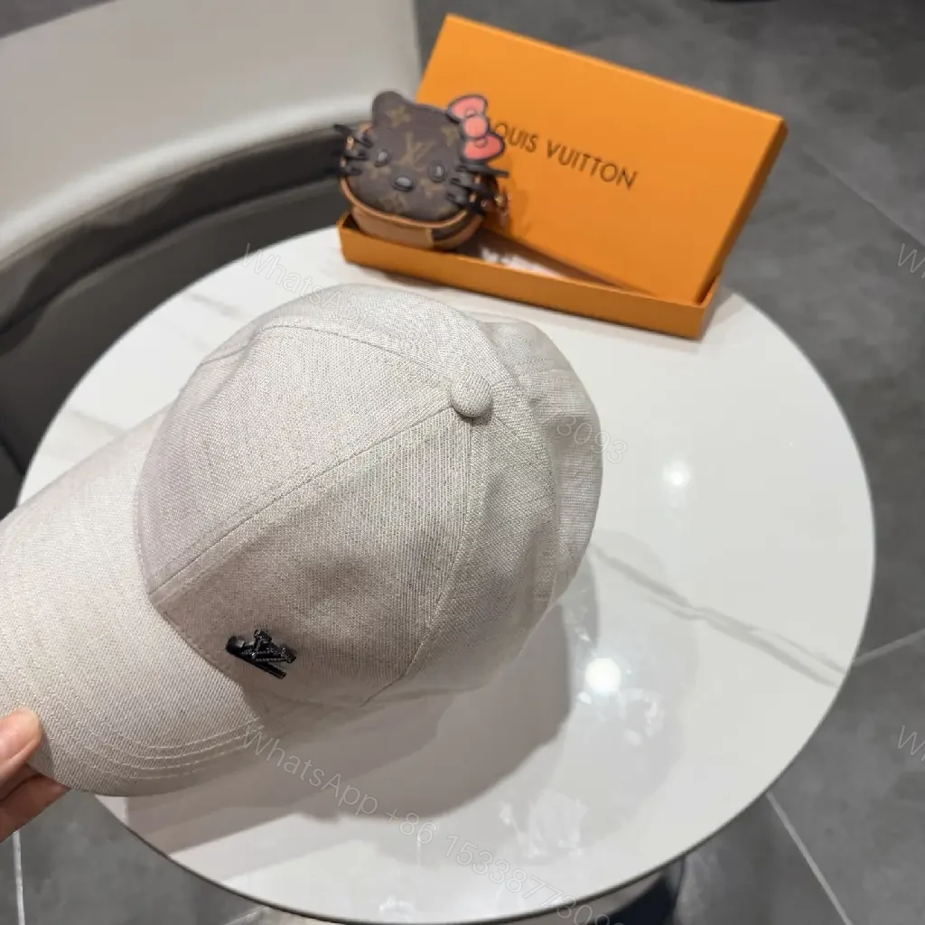 View 2 of Cozy Chic Cap: Subtle LV Logo, All-Season Cotton blend Cap