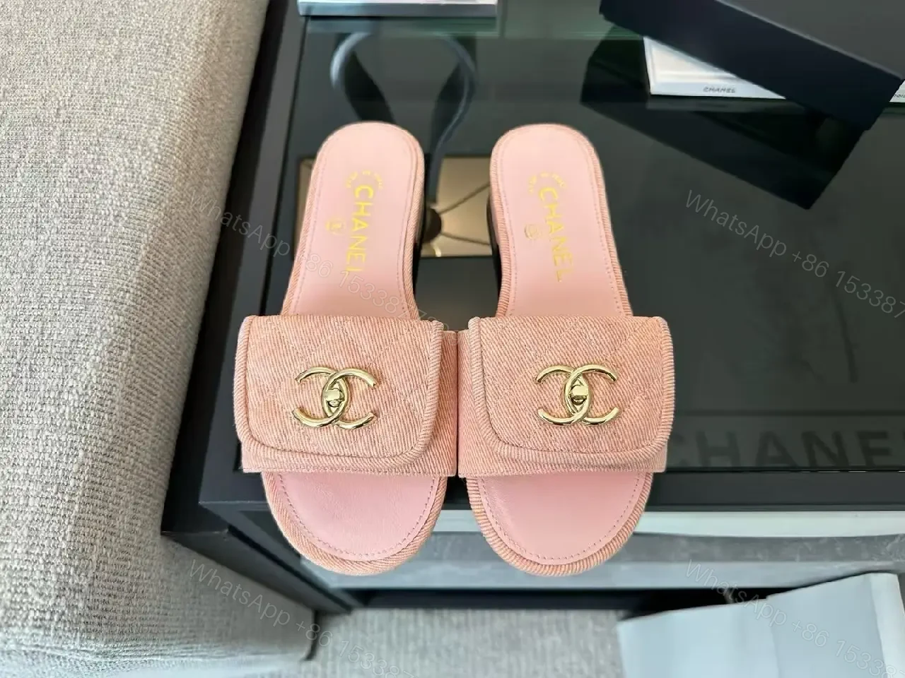 View 9 of Soft Pink Slip-On Sandals with Gold Logo – Luxury Comfort