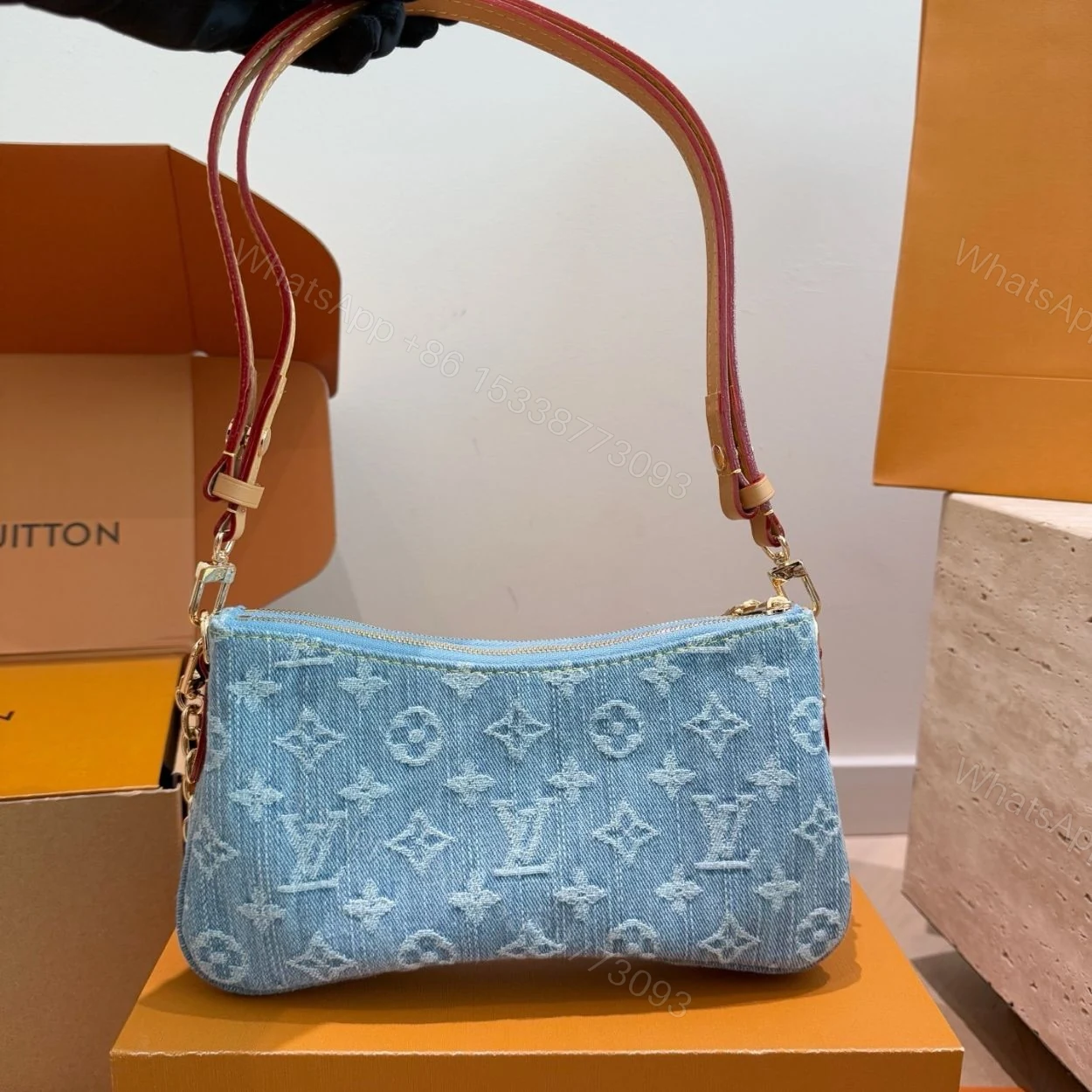 View 5 of Louis Vuitton Liv Pochette Blue Denim 25Cm M83532