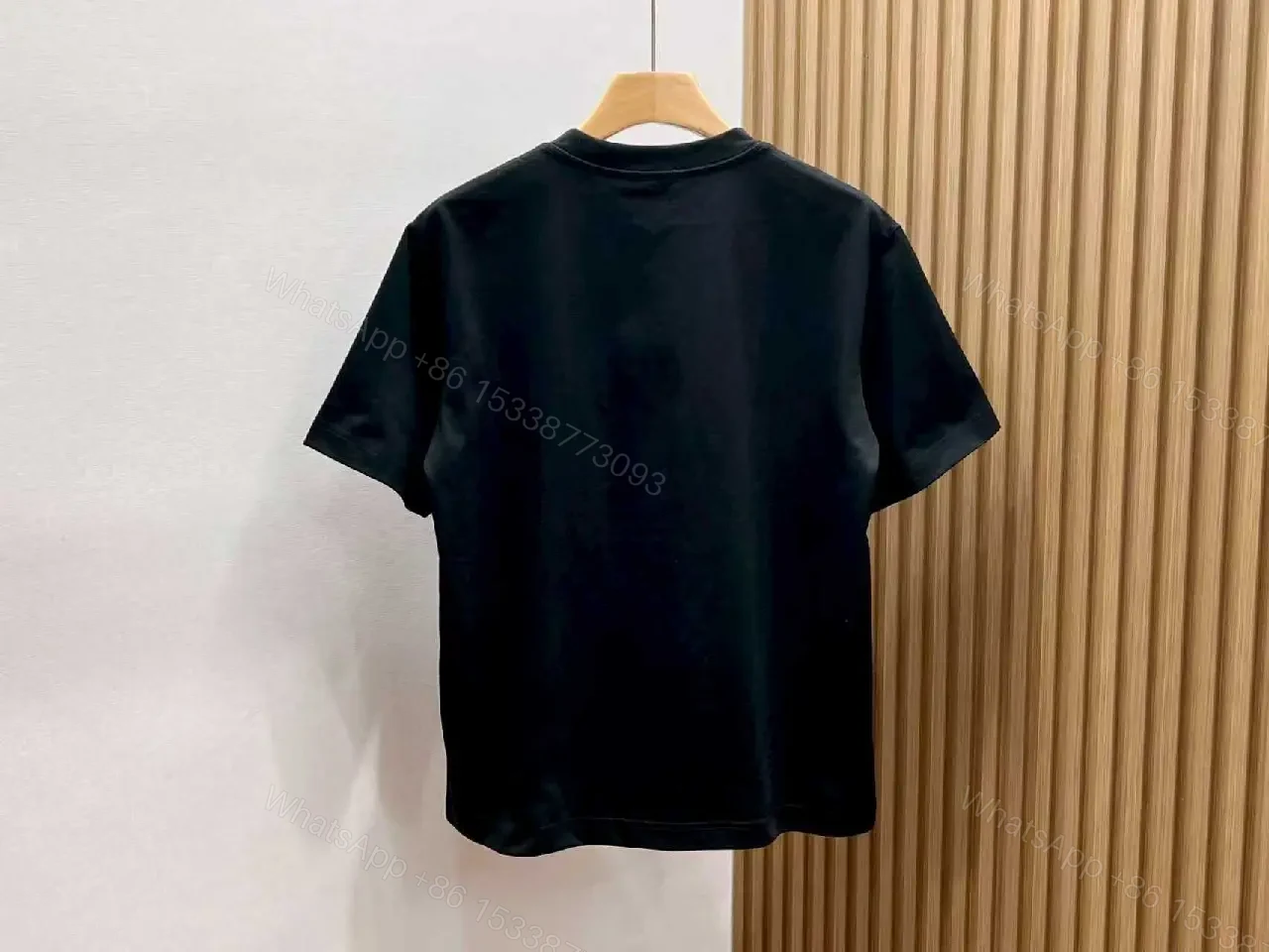 View 6 of Black Knit Tee with Embroidered Crest Logo – Premium Street Style T-shirt