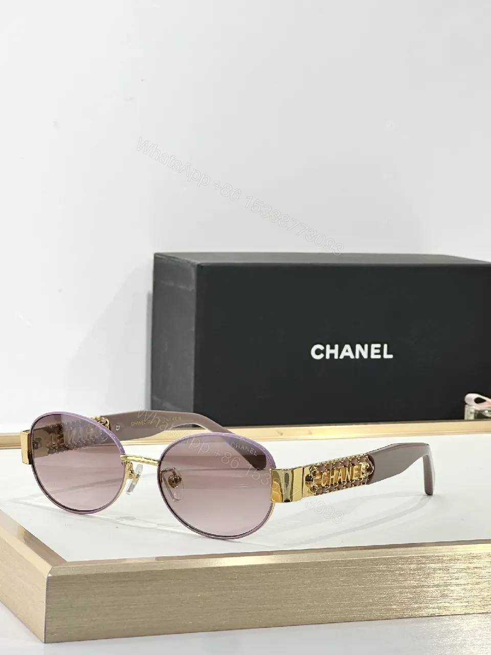 View 2 of Gold-Accented Round Sunglasses: Minimal Luxury Shield