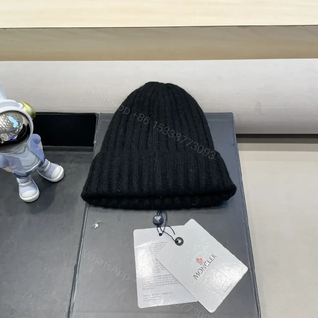 View 2 of Cozy Black Knit Beanie with Signature Patch, Luxury Style