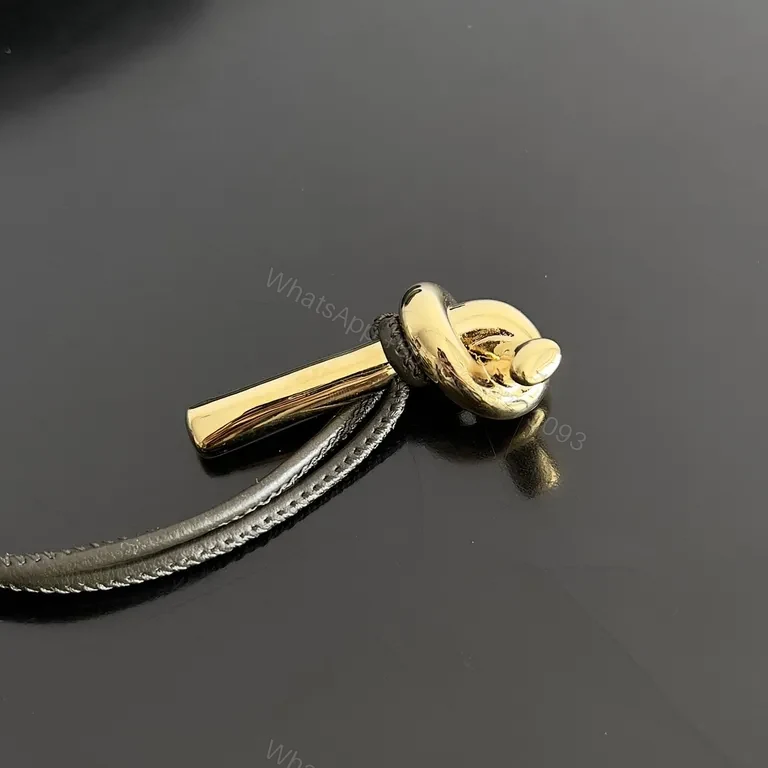 View 2 of Compact Woven Leather Wallet with Gold Clasp - Everyday Luxury