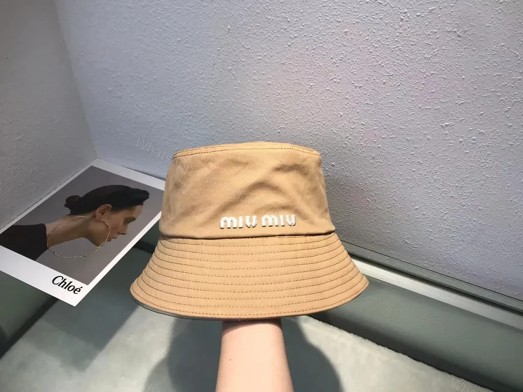 View 3 of Crisp White Miu Miu Bucket Hat: Iconic Logo Shield