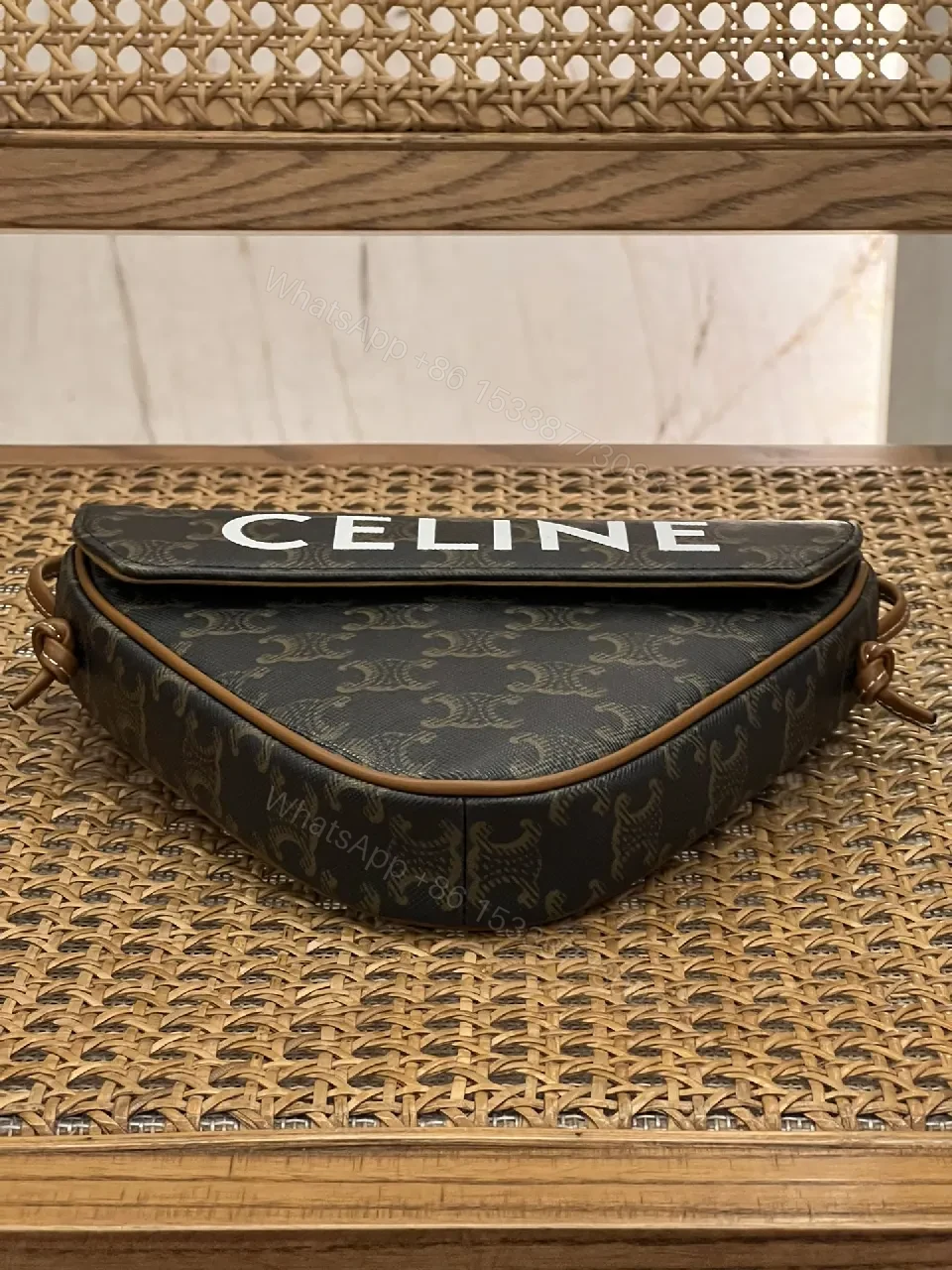 View 5 of Chic Black Monogram Cocoon Bag: Compact Luxury Crossbody