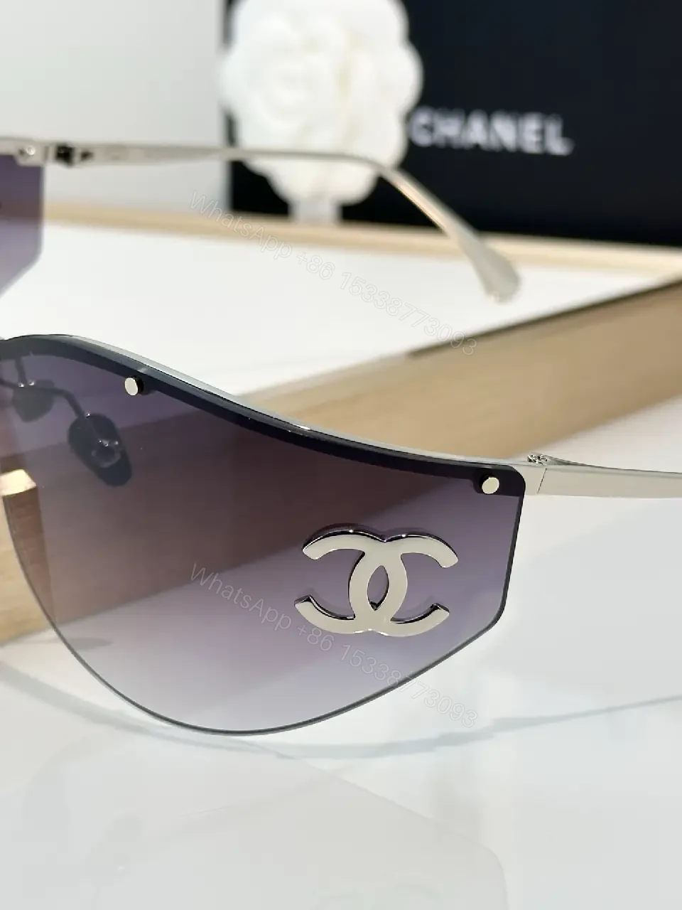 View 5 of Lux Black Gold Shield Sunglasses with Chanel Logo