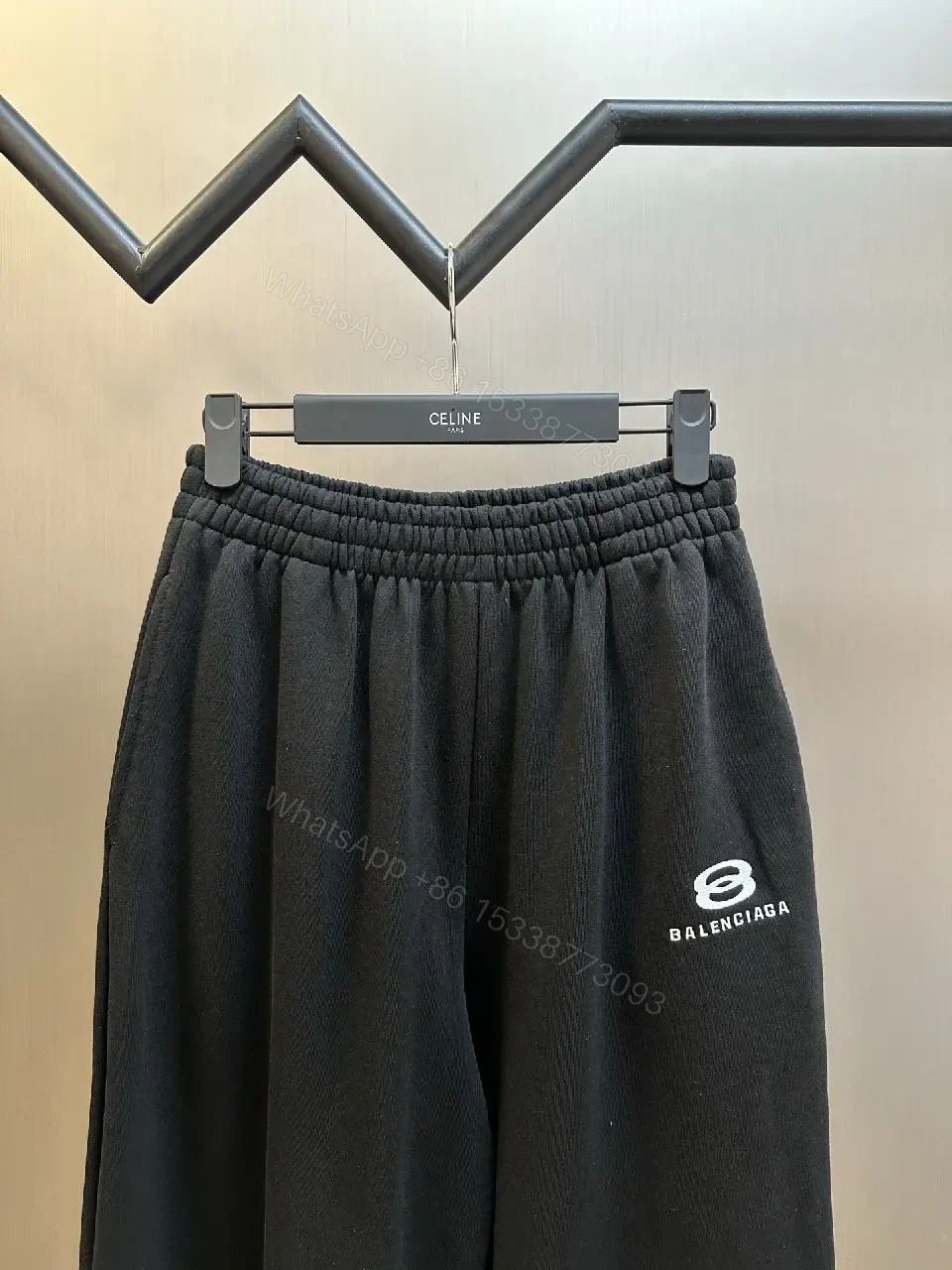 View 8 of Chic Black Wide-Leg Track Pants with Subtle Logo