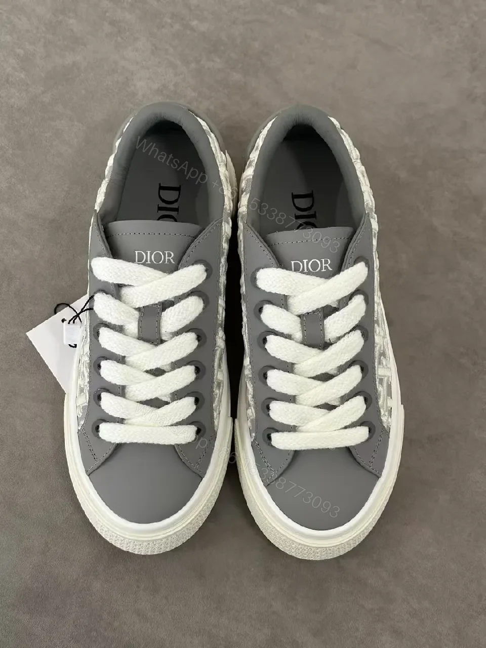 View 5 of Gray Leather Sneaker with Monogram Pattern, Luxurious Texture, Casual High-Tops