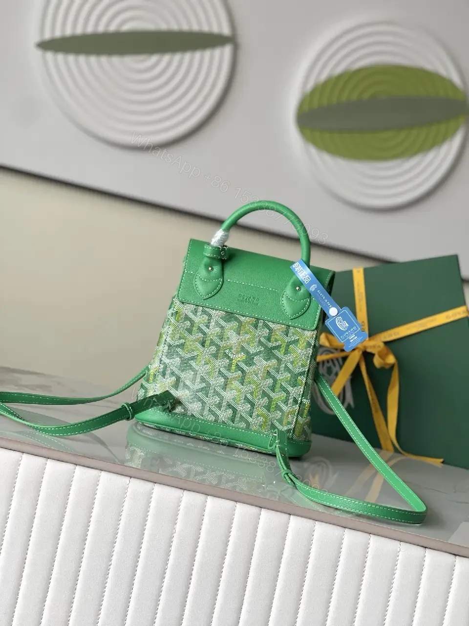 View 5 of green leather mini backpack with monogram pattern and luxury green trim for everyday use