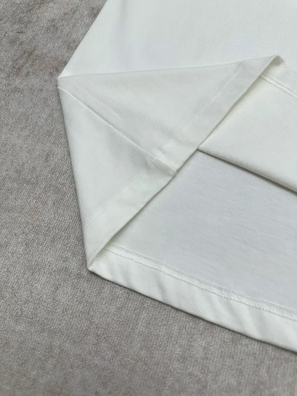 View 6 of Minimalist White Cotton Tee with Embossed Accent, Everyday Luxury