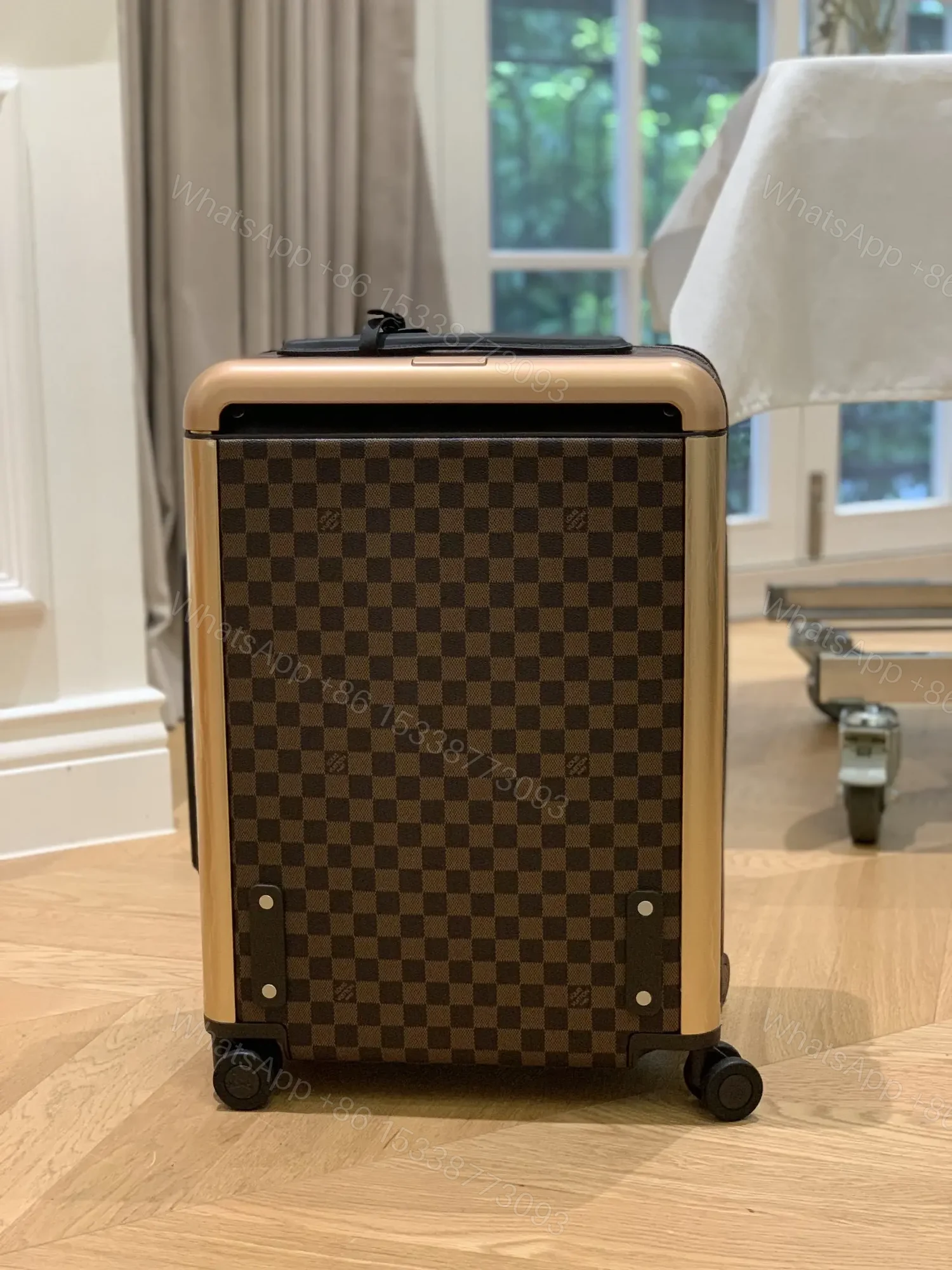View 3 of Louis Vuitton Horizon 55 rolling suitcase in Damier Ebene canvas.