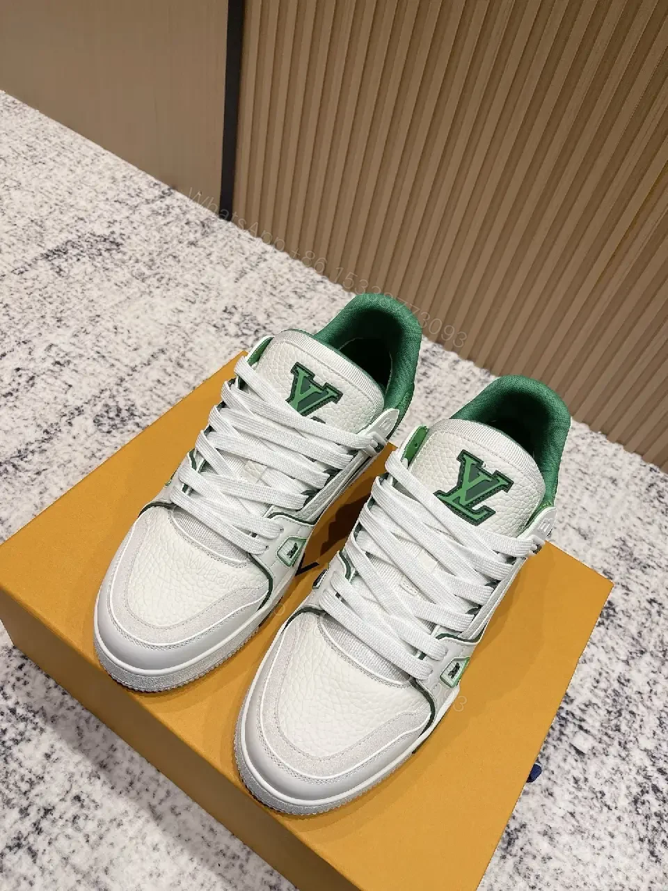 White Leather Sneakers with Green Accents: Luxury Everyday Streetwear — view 1