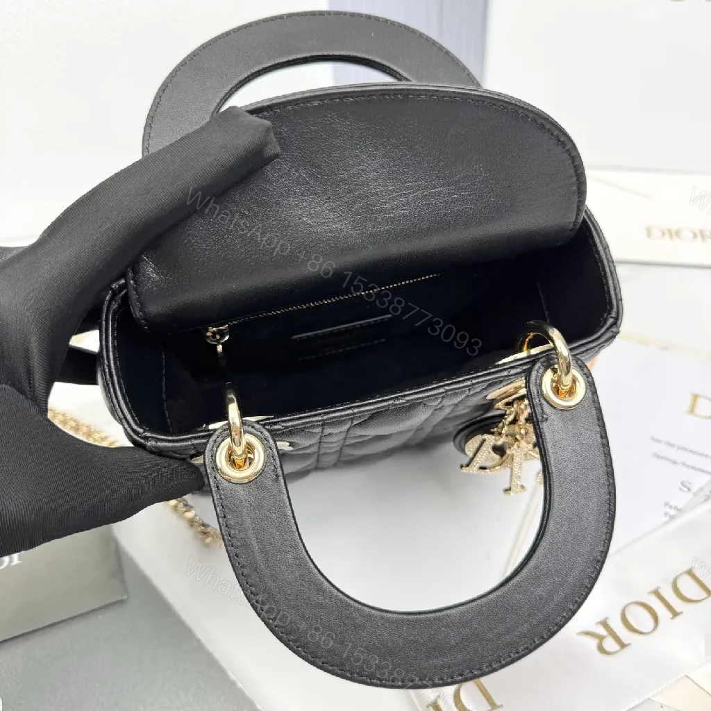 View 7 of Small Black Quilted Mini Bag with Gold Hardware - Elegant Compact Crossbody
