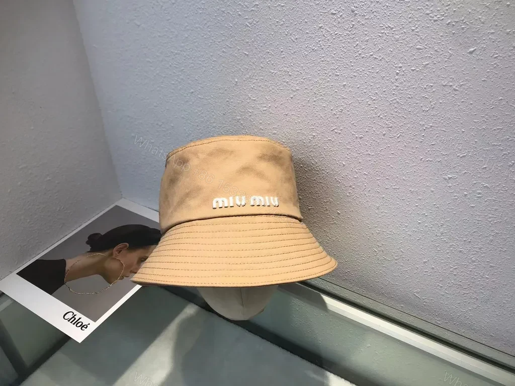 View 9 of Crisp White Miu Miu Bucket Hat: Iconic Logo Shield