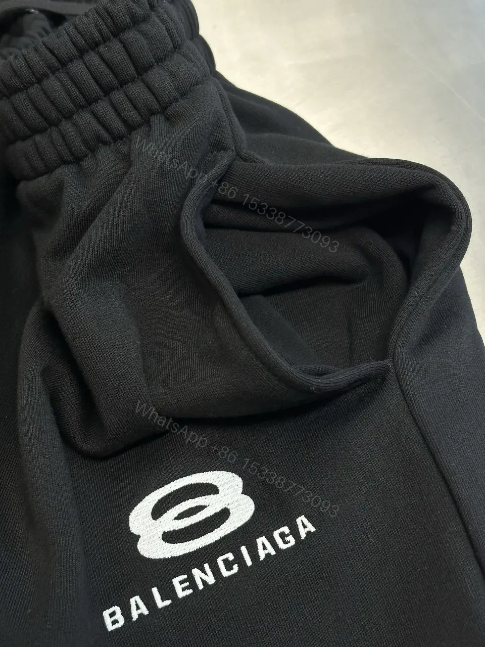 View 2 of Chic Black Wide-Leg Track Pants with Subtle Logo