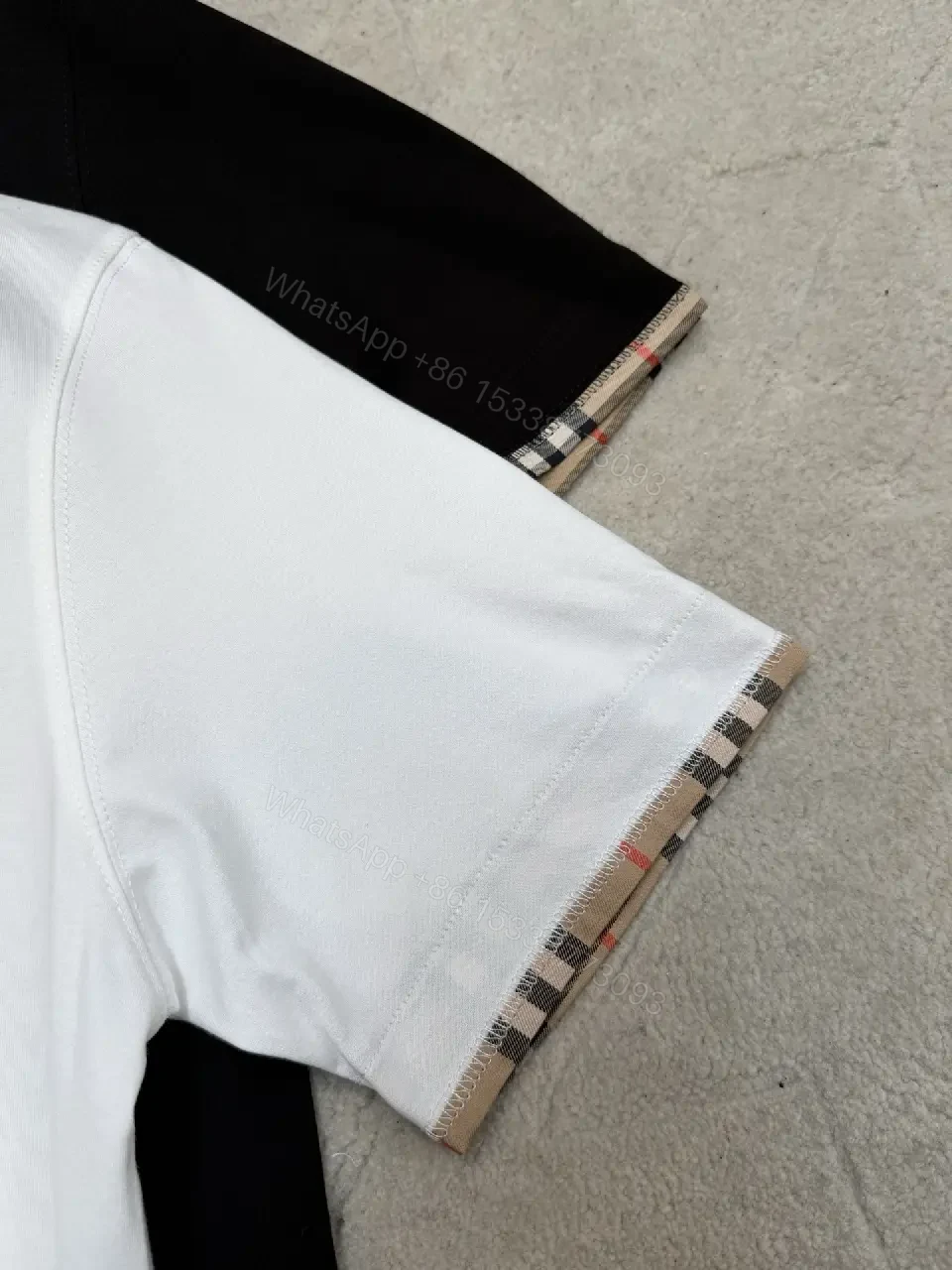 View 3 of Minimalist Black Cotton Tee with Plaid Sleeve Trim