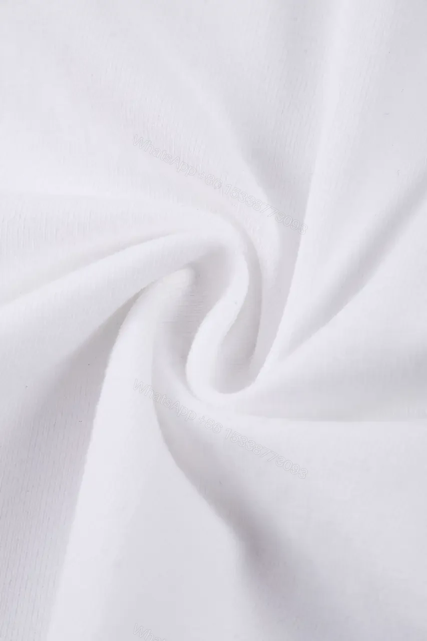 View 10 of Minimalist Luxe Tee: White Cotton, Delicate Embroidery, Everyday Chic