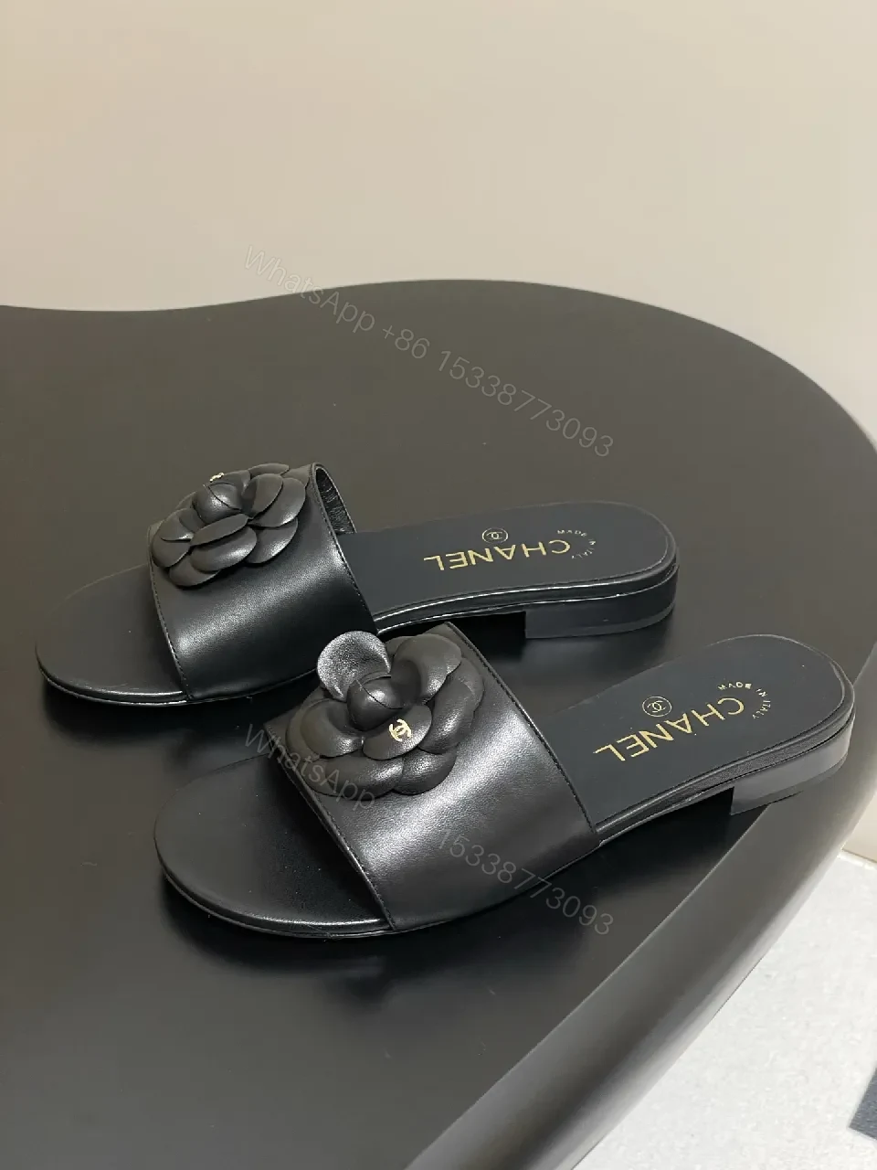 View 5 of Effortless Black Leather Slide with Camellia Detail