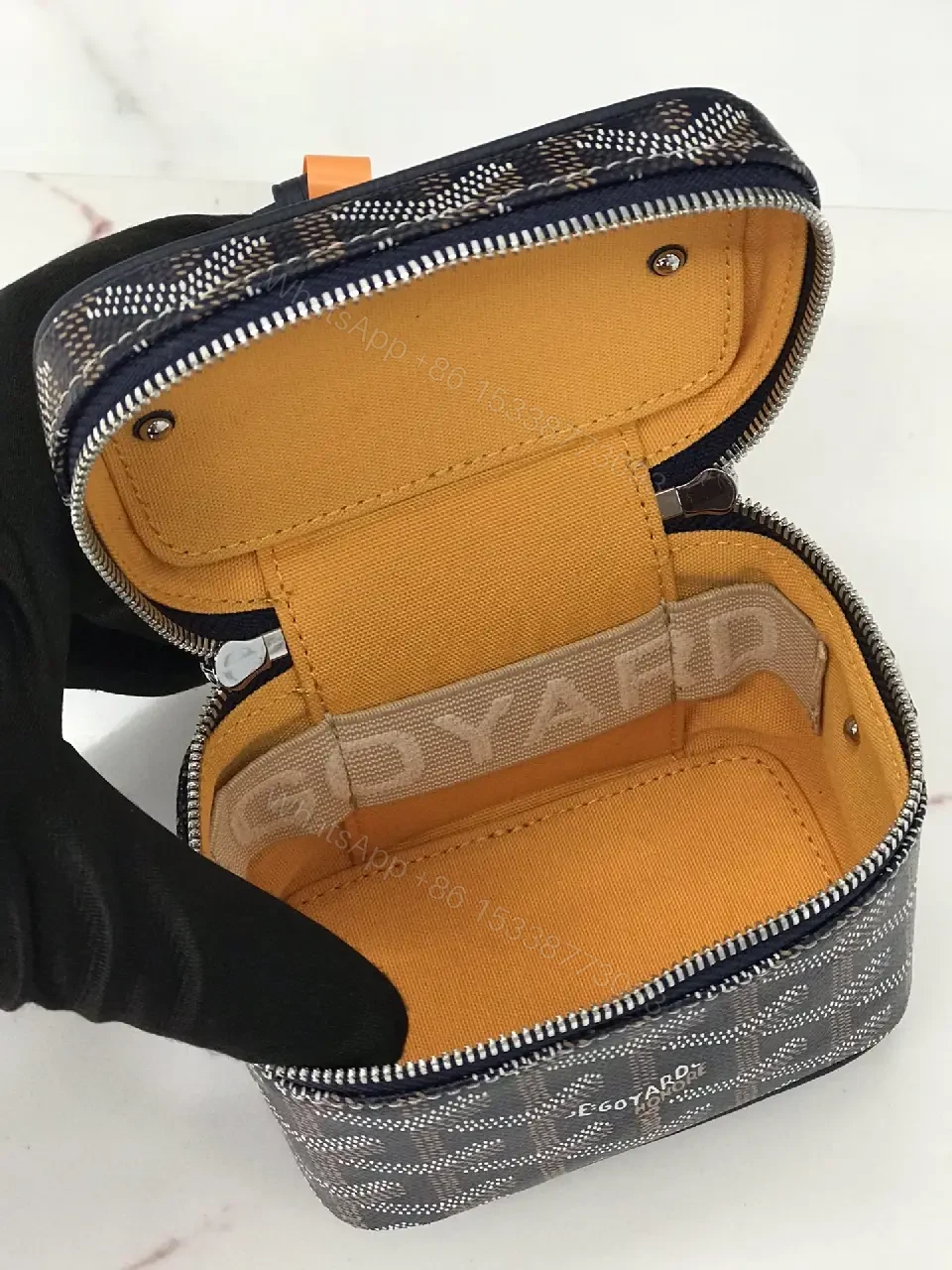 View 2 of Colorful coated-canvas pouch with distinctive pattern, compact design, durable, luxury vibe