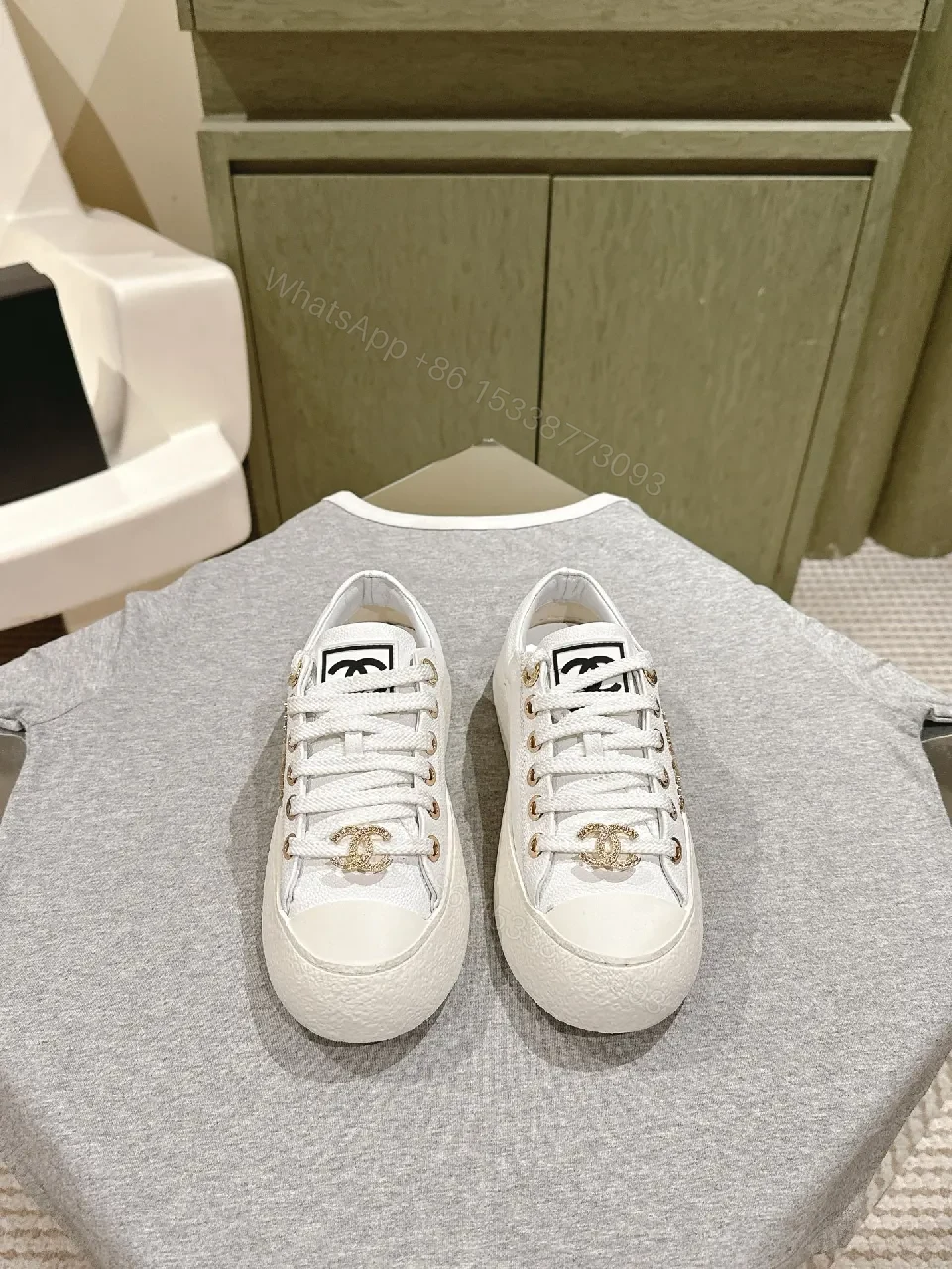 View 2 of White Leather High-Top Sneakers with Gold Accents