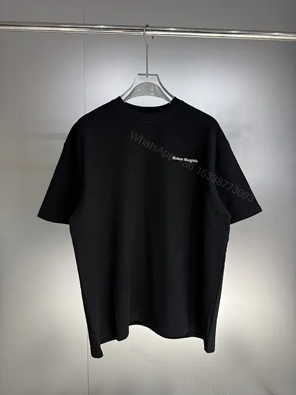 Black Cotton Crewneck Tee + Minimalist Style + Subtle Logo + All-Day Comfort + T-Shirt — view 1