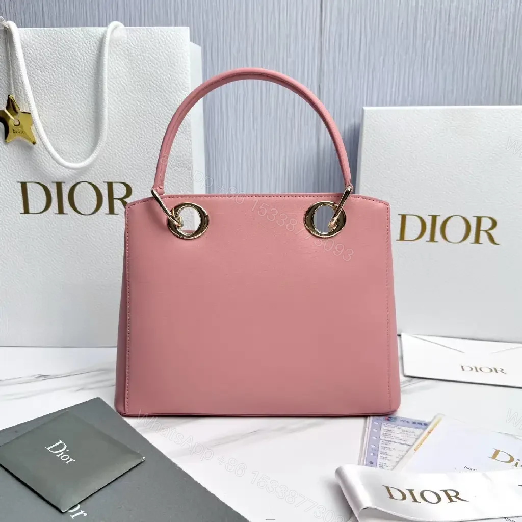 View 5 of Soft Pink Faux-Leather Satchel: Bow Accent, Sculpted Diagonal Panels, Crossbody Comfort