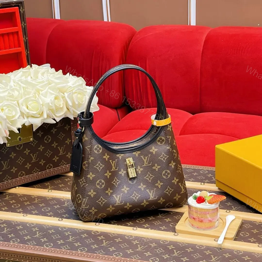 Louis Vuitton The Drop PM Handbag in Monogram Coated Canvas — view 1