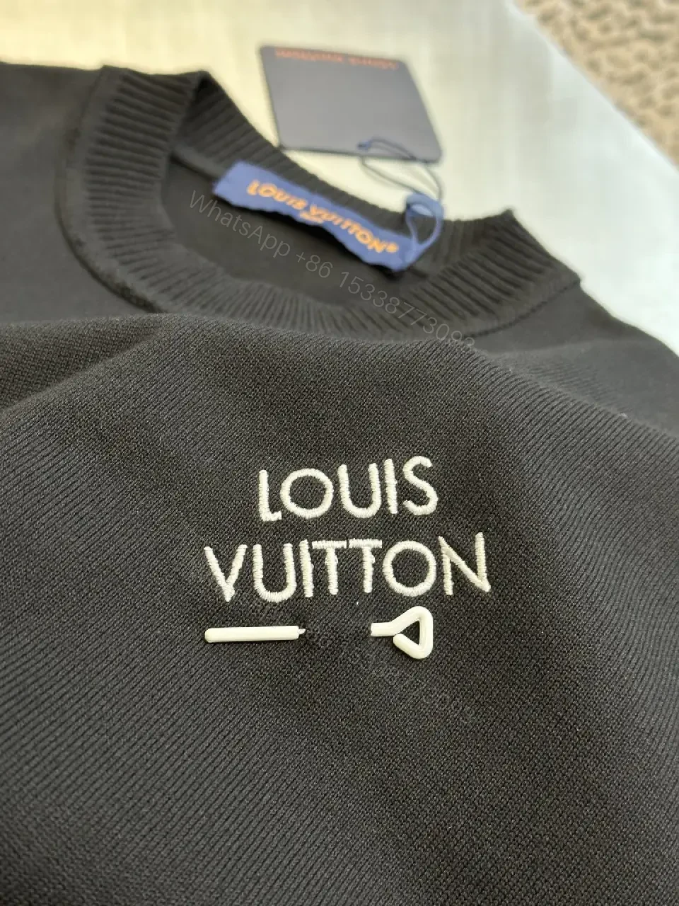 View 7 of Minimalist Black Crewneck Tee Dress – Subtle Logo, Versatile Dress