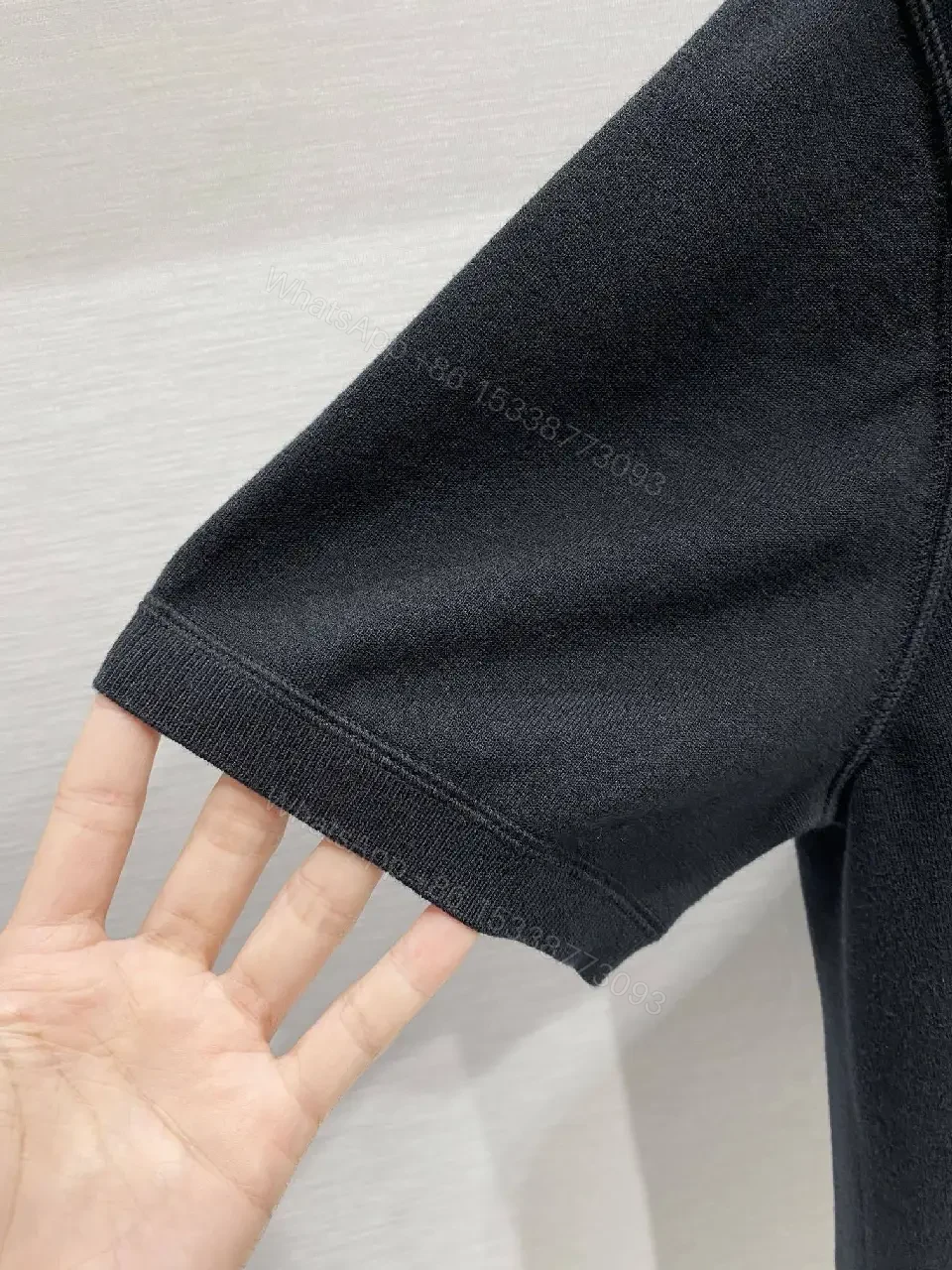 View 2 of Minimalist Cotton Tee with Crest – Elevated Everyday Essential