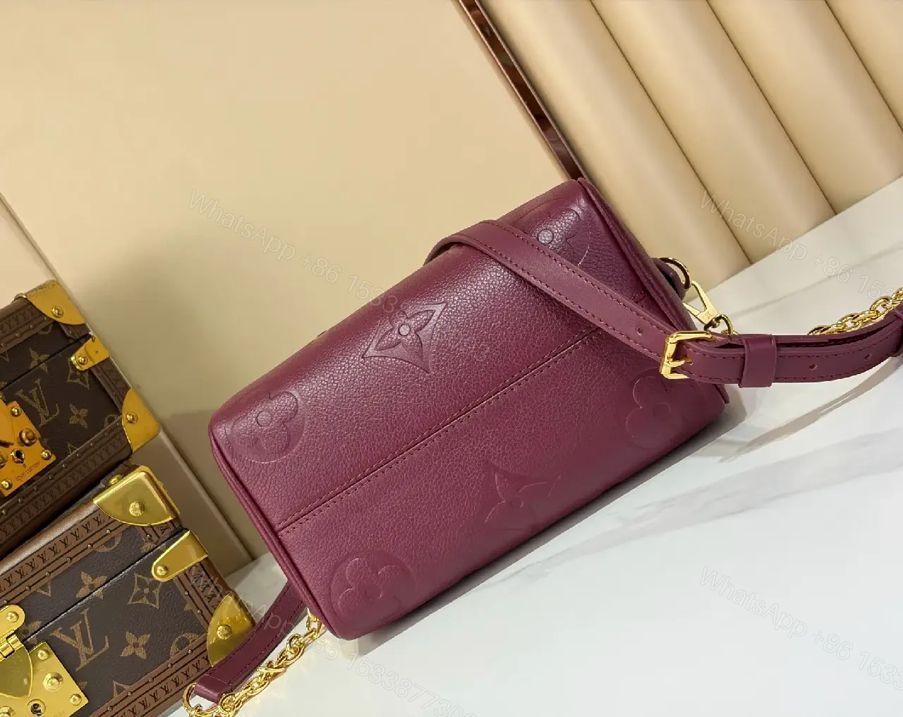 View 4 of Deep Plum Leather Satchel: Structured Top-Handle Bag with Embossed LV Motifs