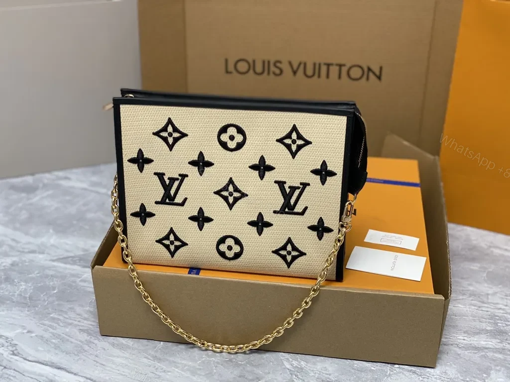 View 2 of Monogram LV Clutch: Black Trim, Gold Hardware, Day-to-Night