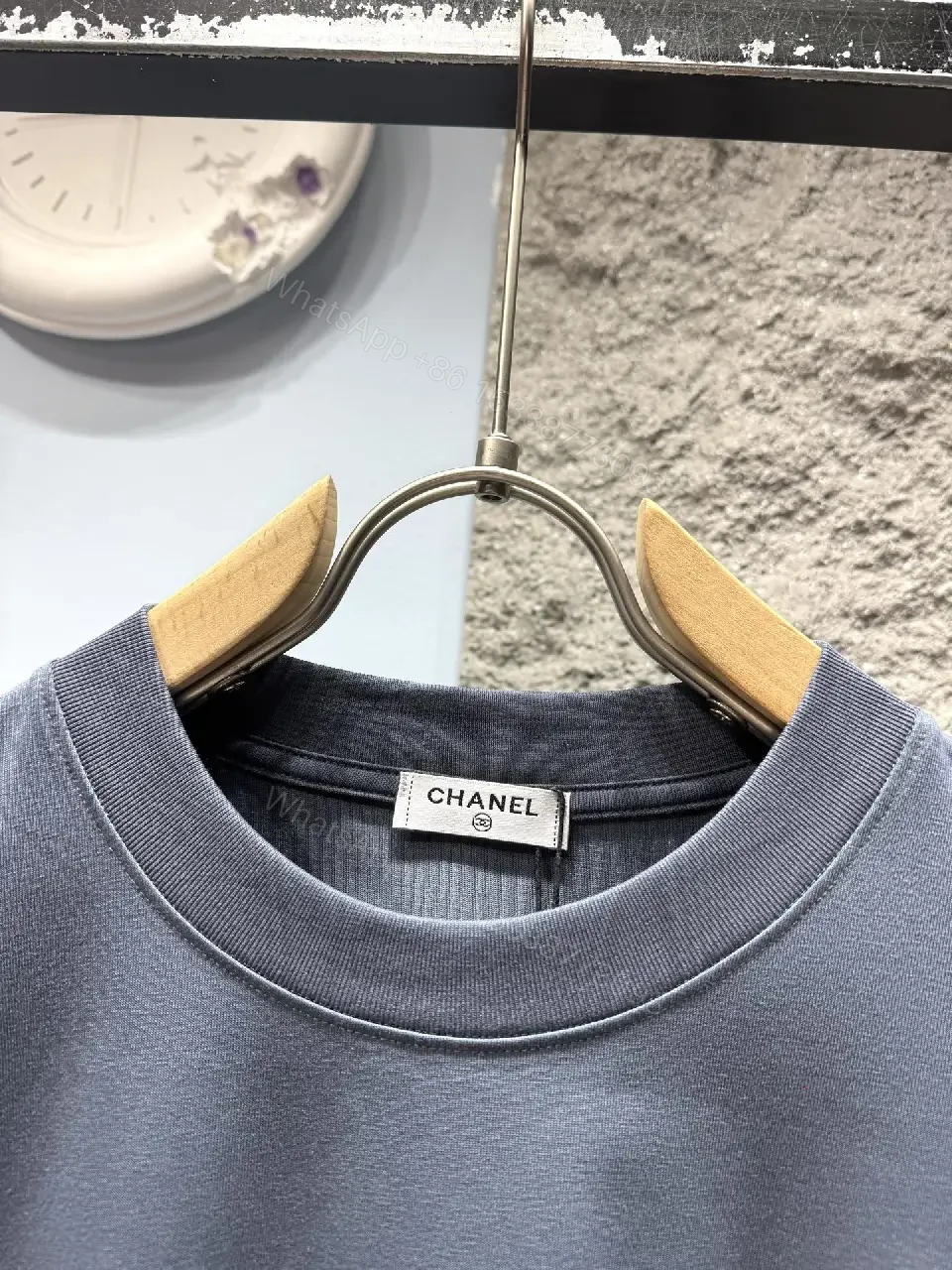 View 8 of Navy Knit Tee: Subtle Crest, Luxe Texture, Relaxed Fit Top