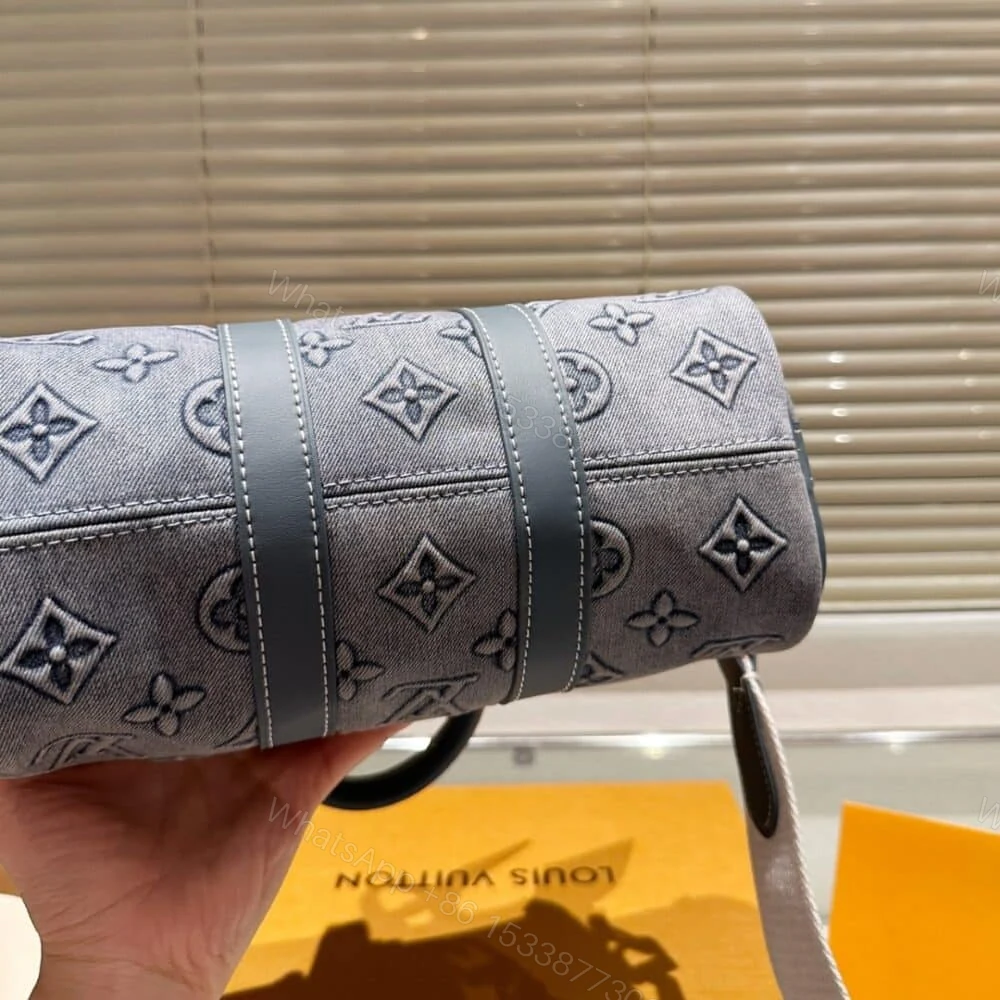 View 5 of Louis Vuitton Keepall Bandoulière 25 Monogram Washed Denim Canvas 24Cm M22762