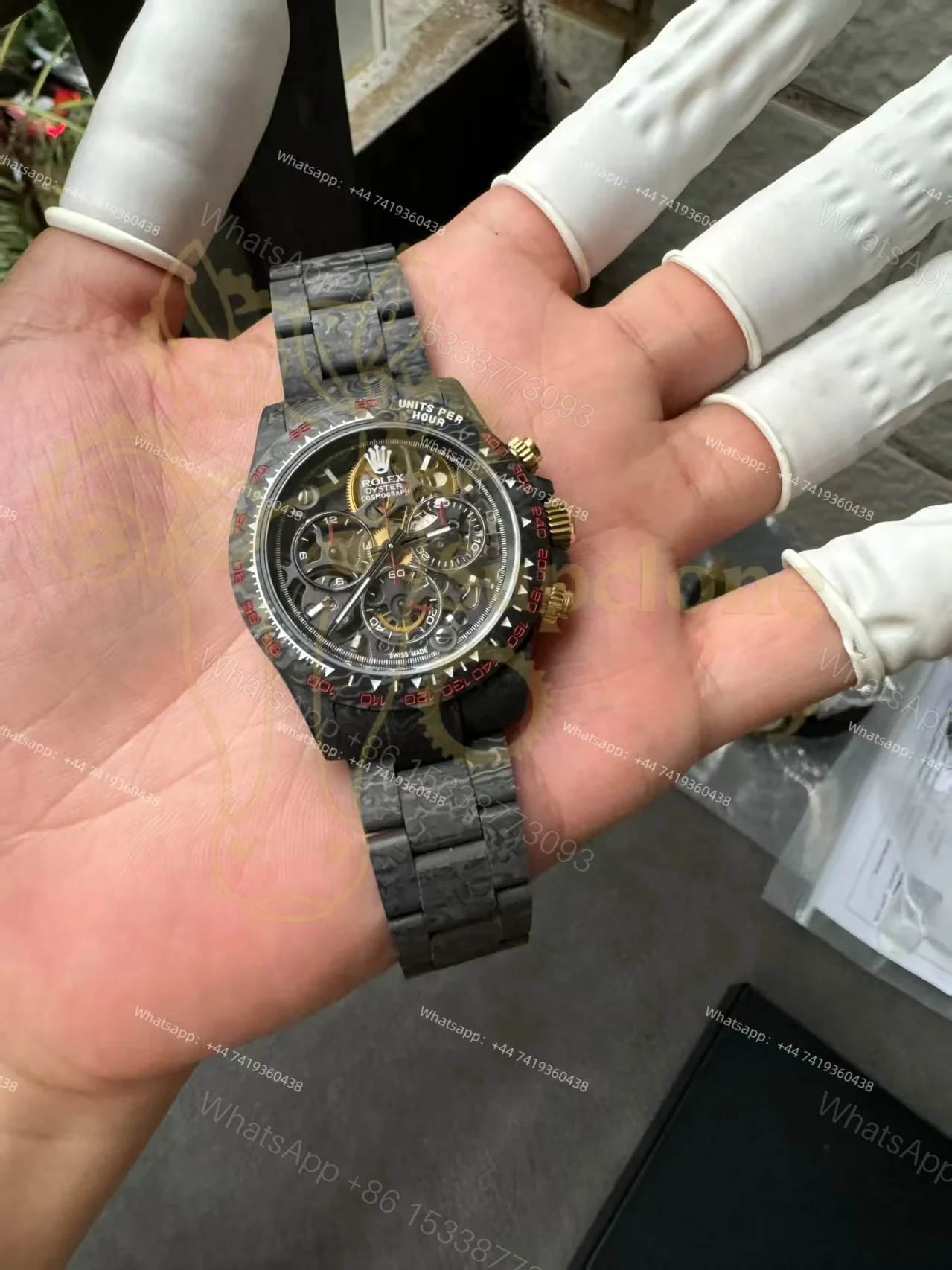 View 2 of Rolex Super Clone Carbon Fiber Daytona Skeleton Red Accents Gold Pushers