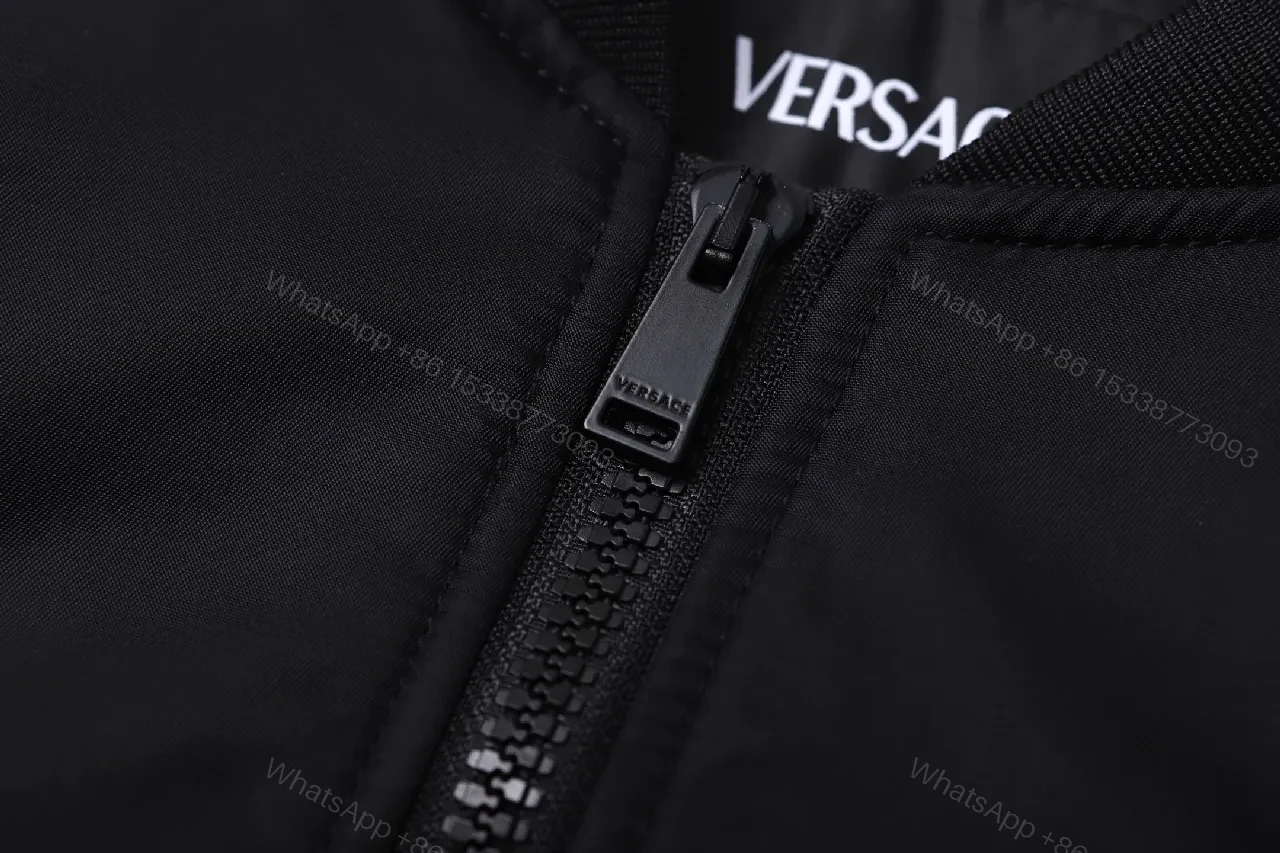 View 8 of Minimalist Black Bomber with Gold Accent: Modern Luxury Outerwear
