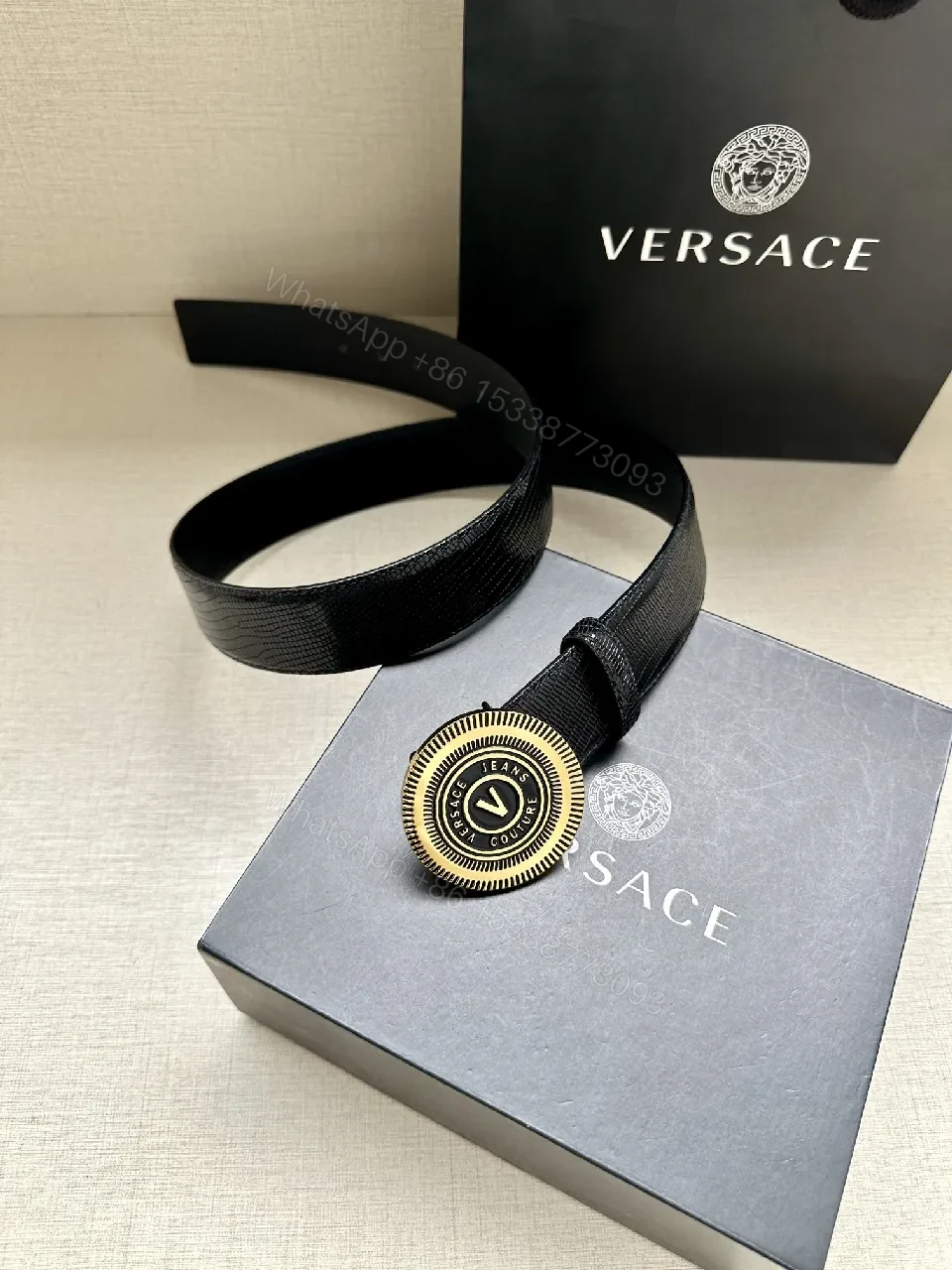 View 7 of Textured Leather Belt with Round Emblem Buckle – Luxe Minimalist Style
