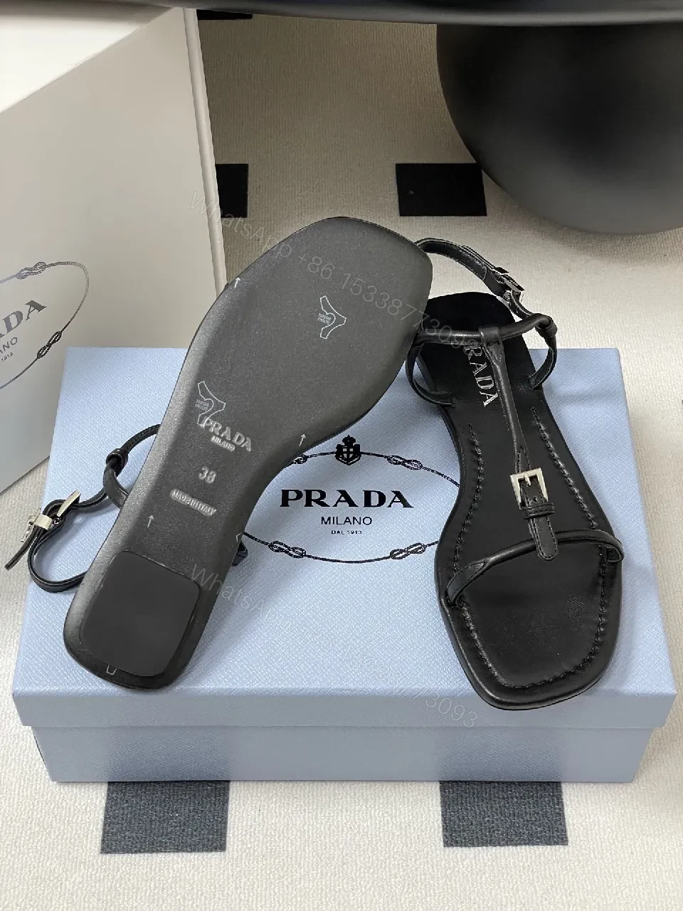 View 8 of Minimal Black Leather T-Strap Sandals with Padded Comfort