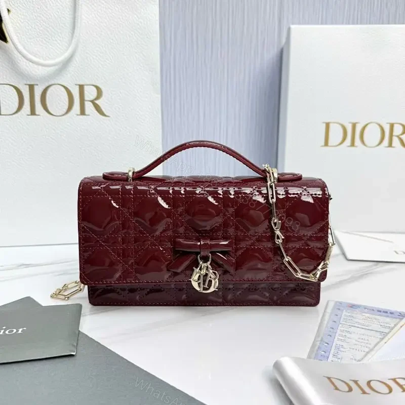 Glossy Burgundy Quilted Mini Bag with Bow Accent — view 1